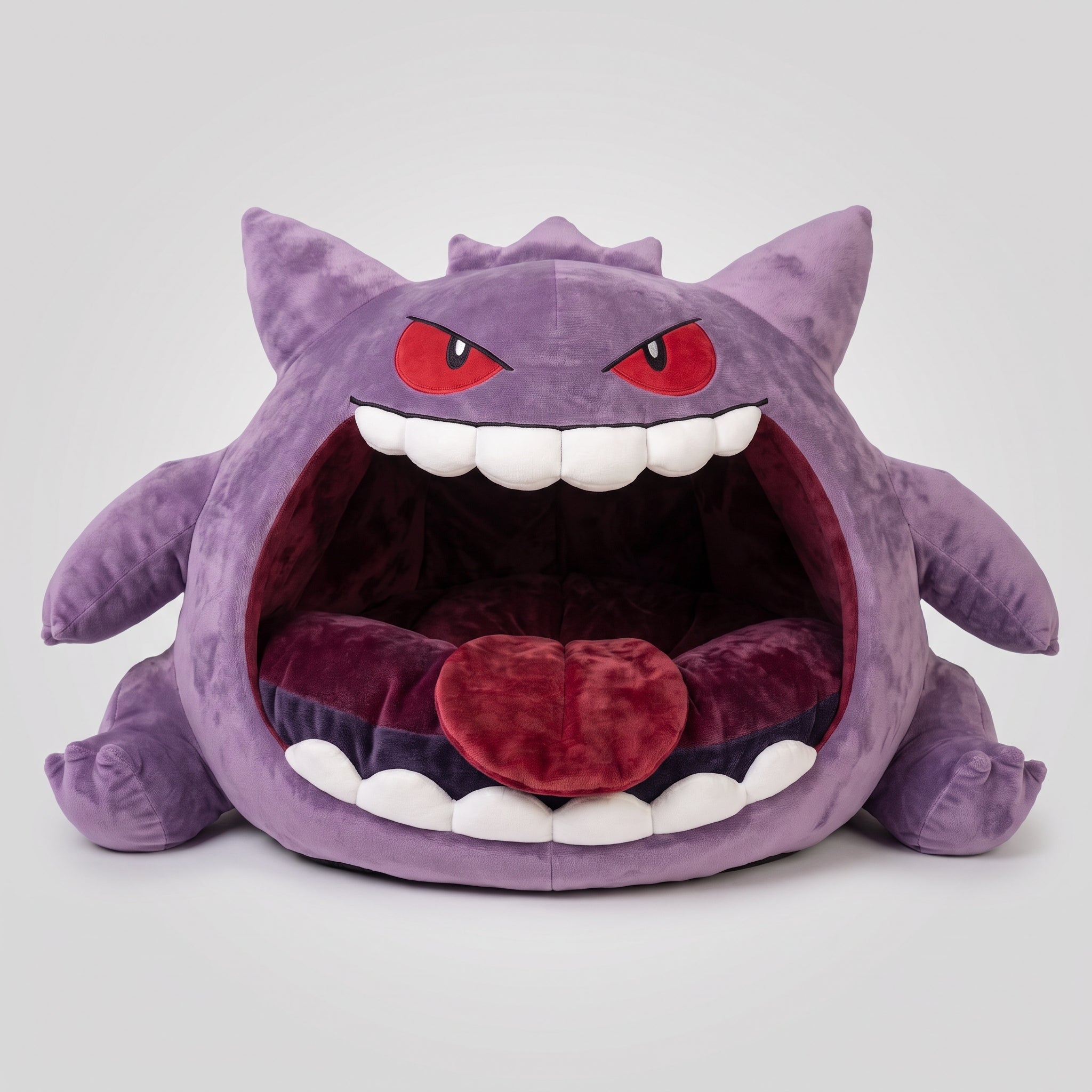 Purple monster cave pet bed with an open mouth design, white felt teeth, and soft red cushion.