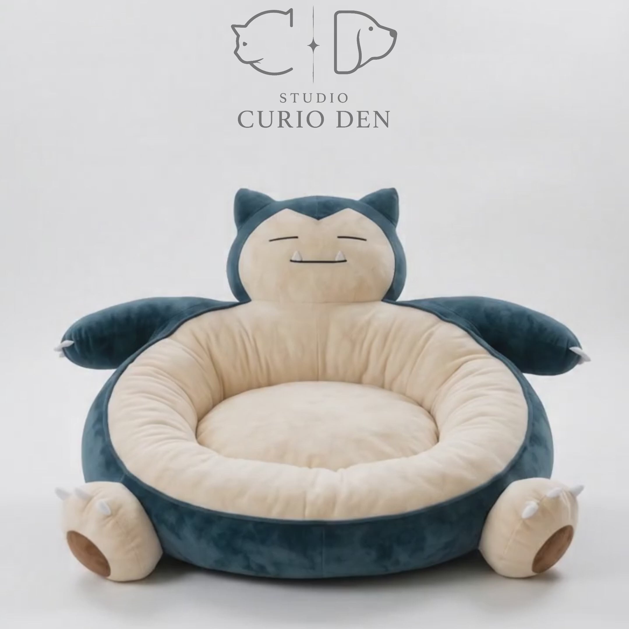 Round blue and beige sleepy chubby monster plush pet bed with deep center cushion.